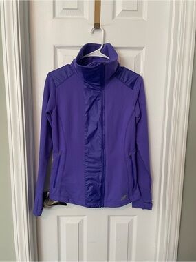 New Balance Novelty Heat purple zip-up jacket.